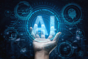 A hand is reaching out and holding a graphic with the text "AI" and circuit board designs.